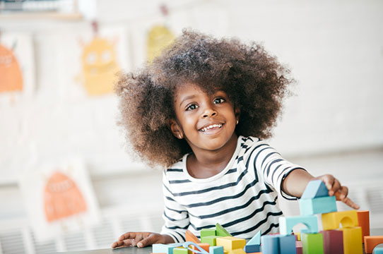 Girl Playing with Blocks